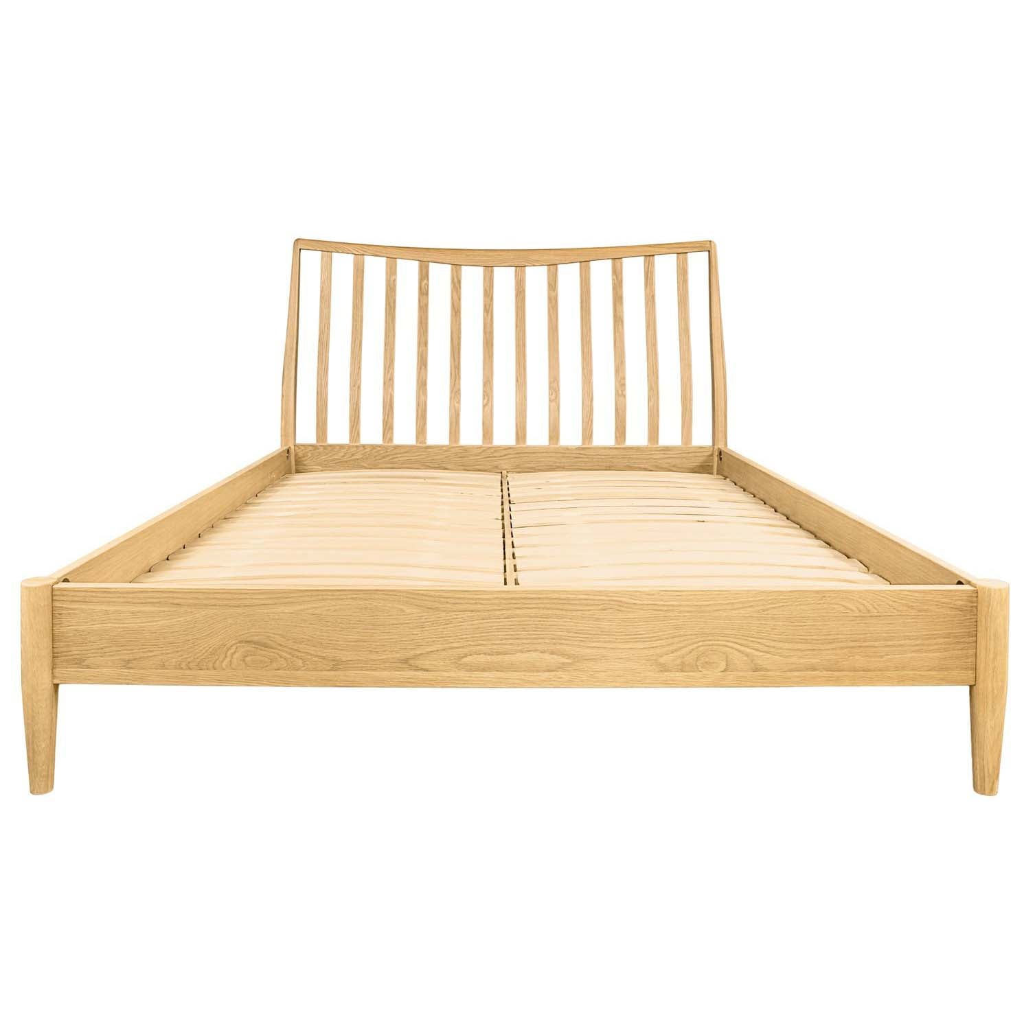 Front view of the empty oak bed frame showing the wooden slat support system
