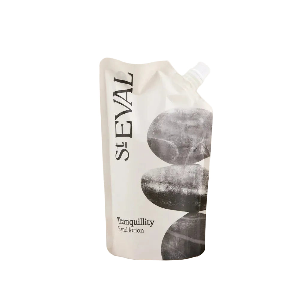 Tranquility hand lotion refill pouch featuring a zen stone design and white screw cap.