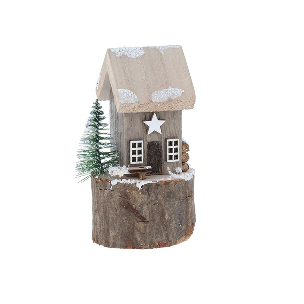 Grey wooden folk art cottage with a white star and bottle brush tree on a natural log base.