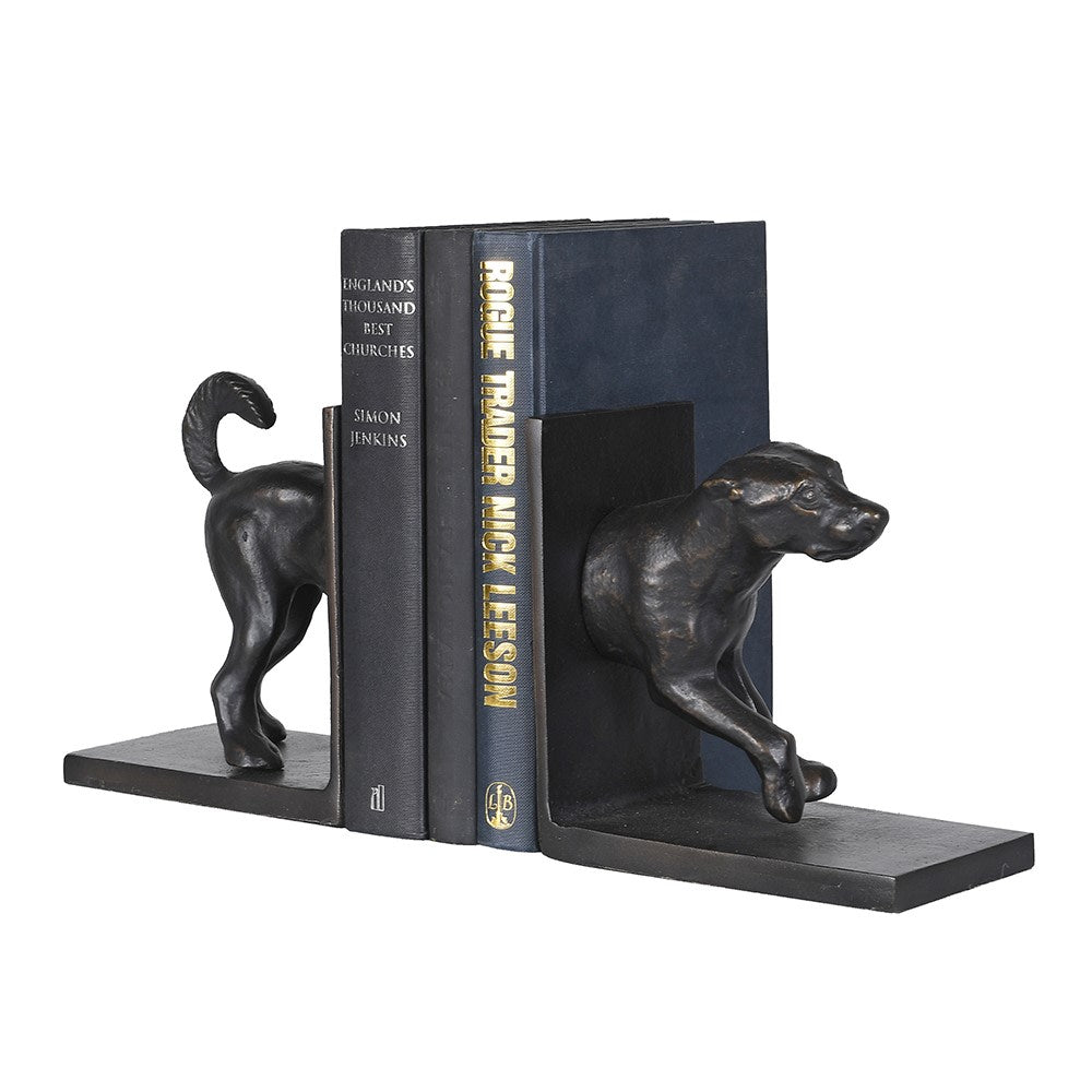 Vintage hound bookends in dark bronze-effect finish holding three blue and black books.