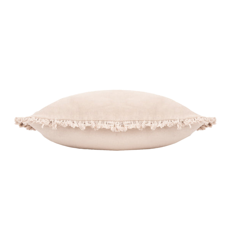 Side profile of the Bertie natural velvet cushion showing the plush feather filling and ruffled edge
