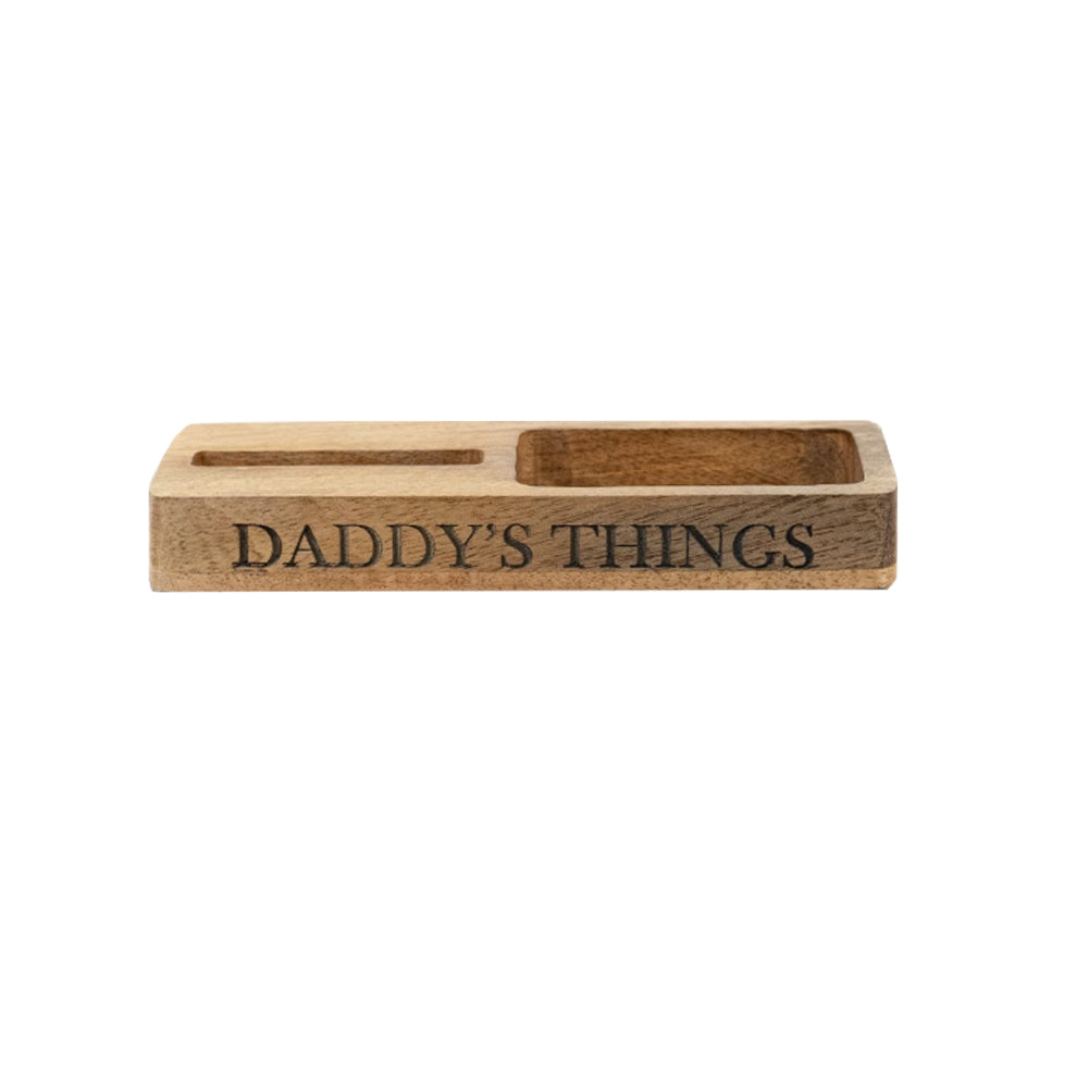 Wooden mobile phone stand and organiser tray engraved with 'DADDY'S THINGS' on a white background.