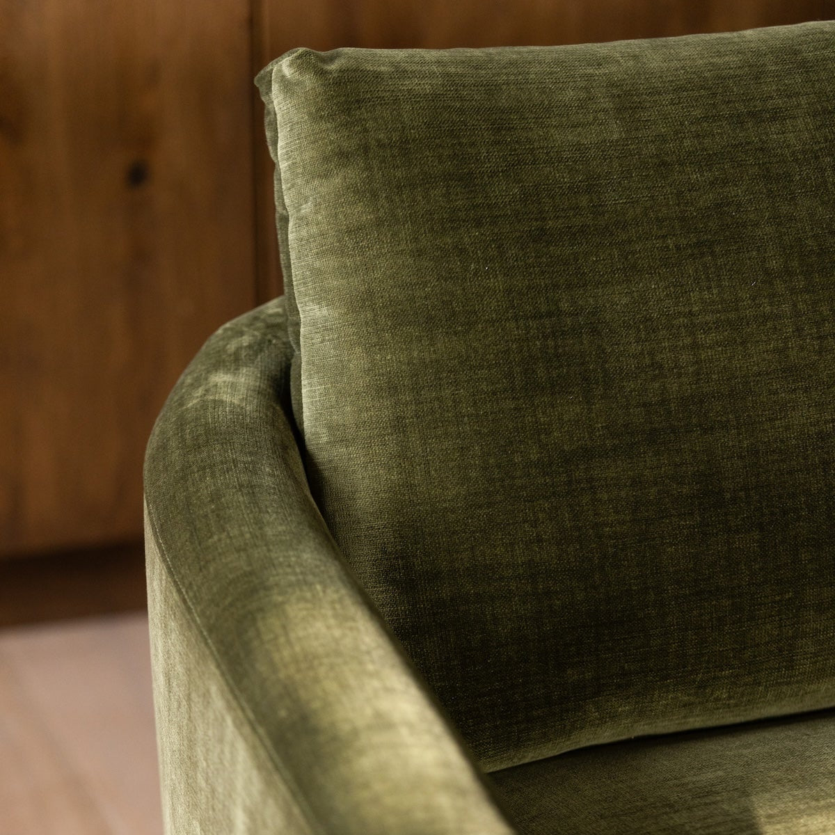 Close-up of the olive green fabric upholstery on the Florence sofa showing the woven texture
