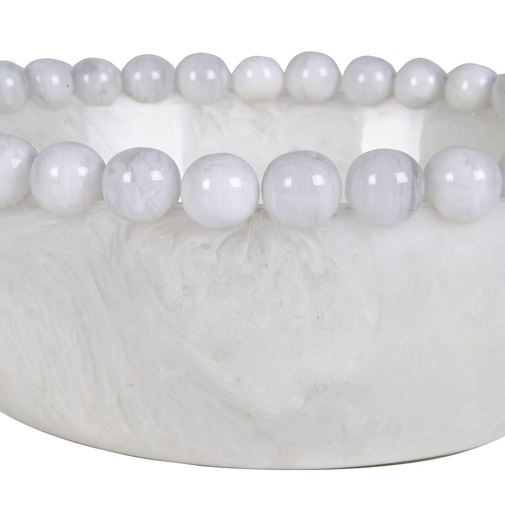 Close-up of the smooth bobble-edge rim and glossy white resin texture on the display bowl