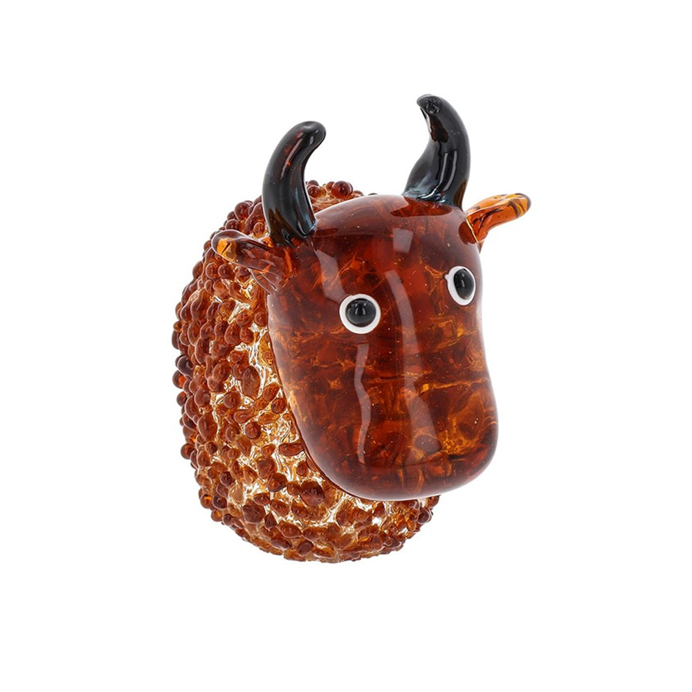 Close-up of a glass Highland cow showing the unique bubbled texture and artisan spotted patterns.