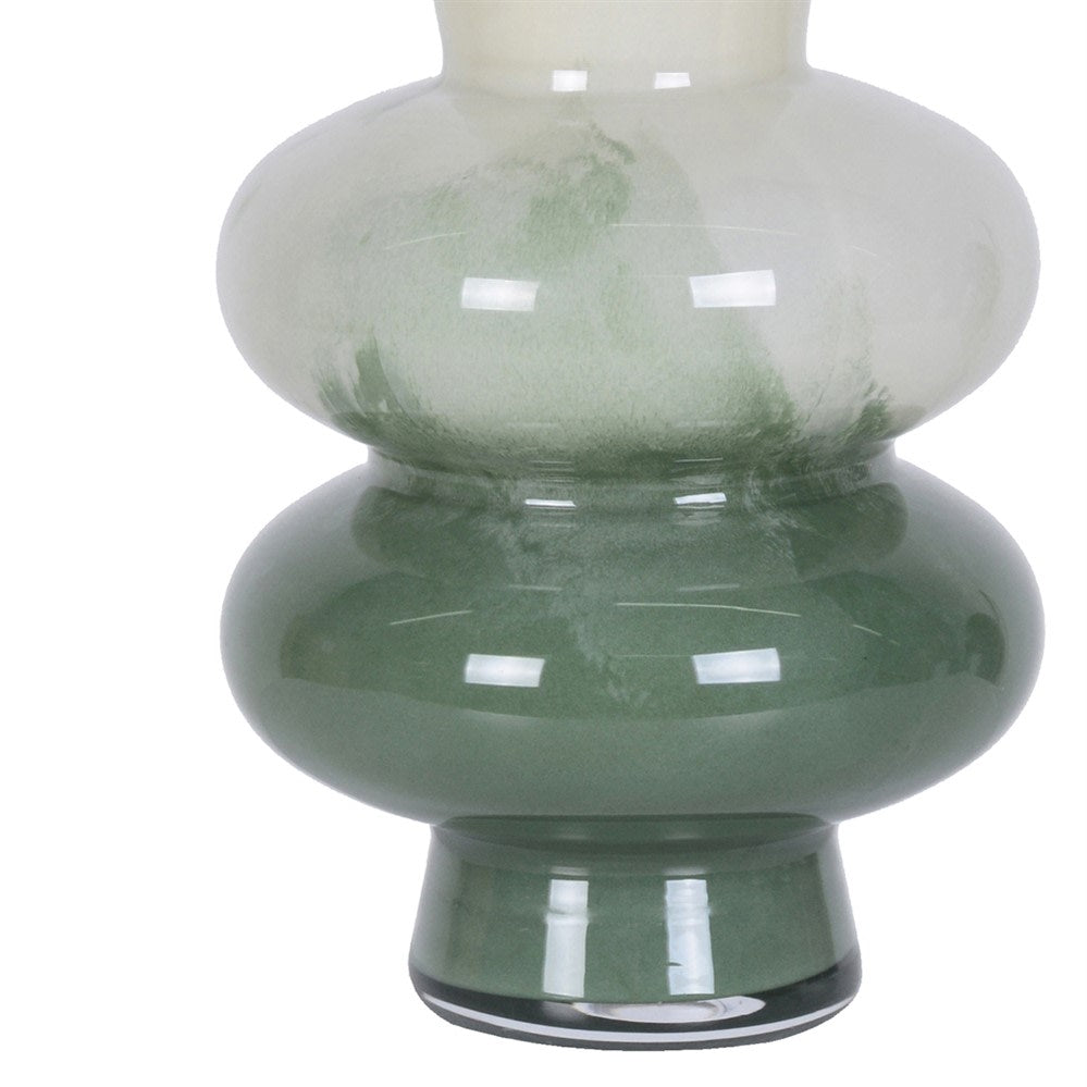 Close-up of the deep green glass base and textured colour transition on the cream vase