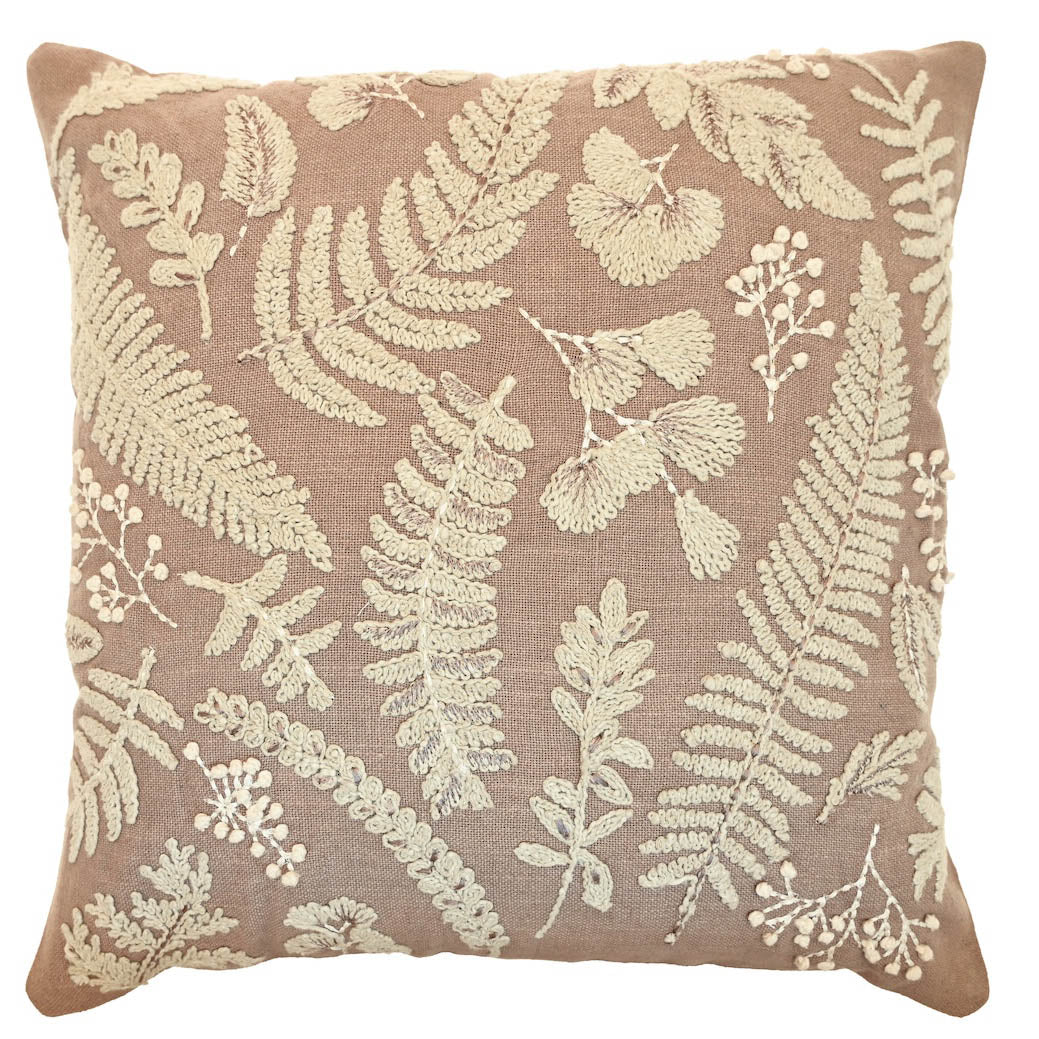 Square birch-coloured cushion with cream embroidered botanical leaf and fern patterns.