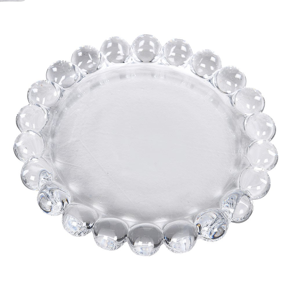 Top-down view of a clear glass candle plate with a decorative beaded circular edge.