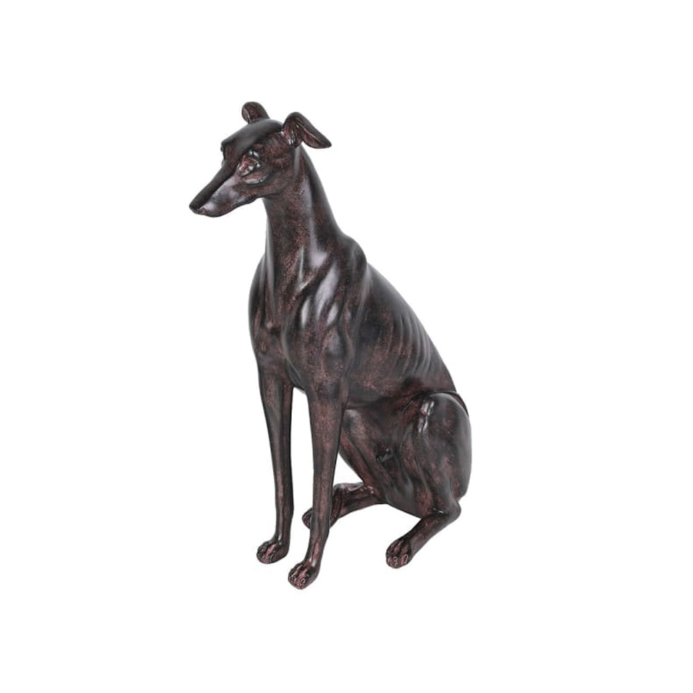 Three-quarter view of a sitting hound sculpture with a dark bronze-effect finish and alert ears.