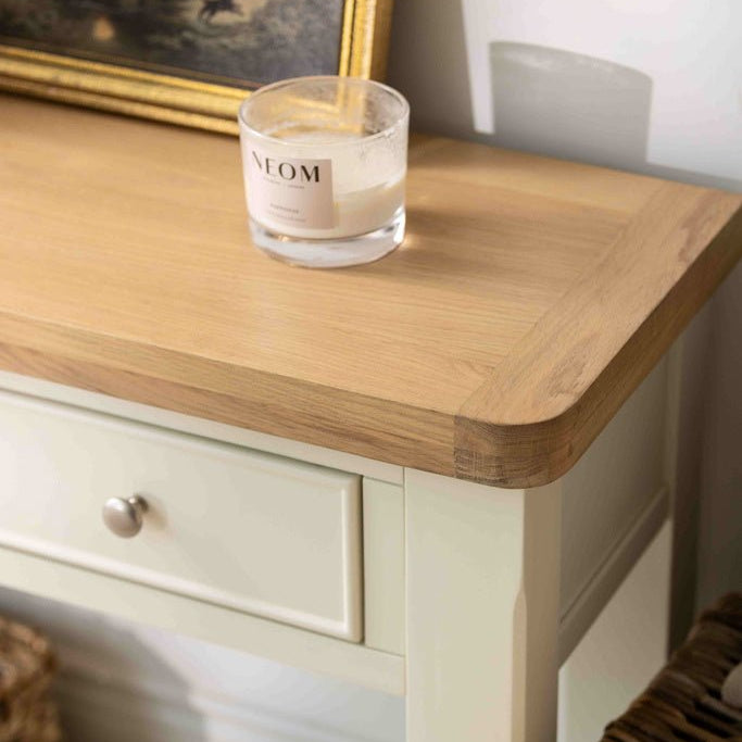 Close-up of the natural oak grain on the rounded corner of the Burford console table