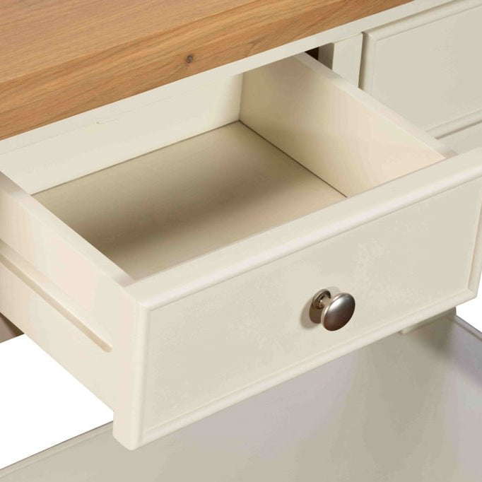 Close-up of an open drawer on the Burford console table showing internal storage space