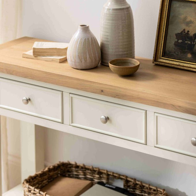 Detailed view of the oak surface styled with vases and a picture frame