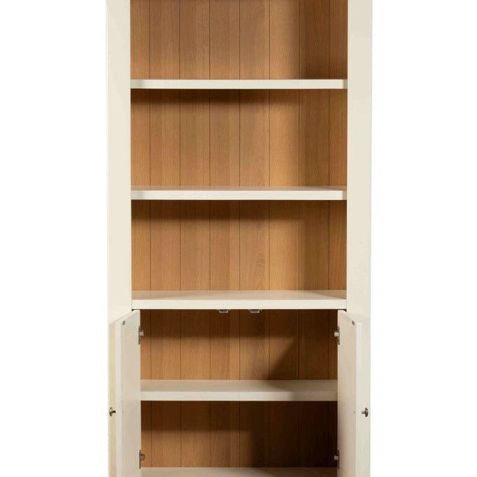Front view of the Burford bookcase with cupboard doors open showing internal wooden shelving