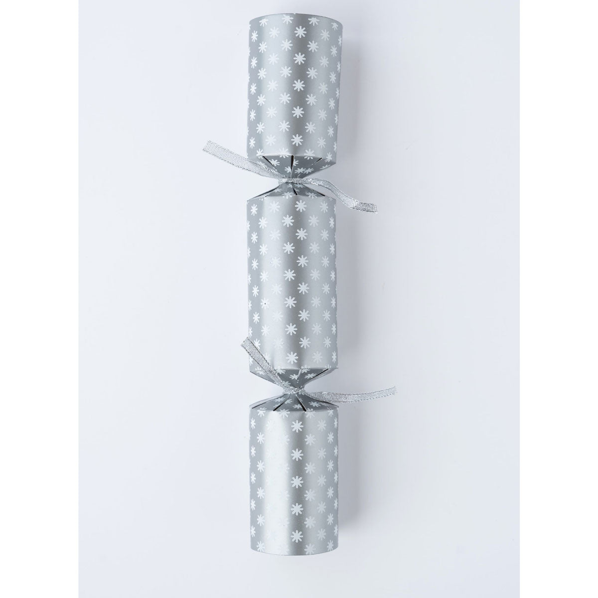 Single silver Christmas cracker with white snowflake print and silver ribbon ties