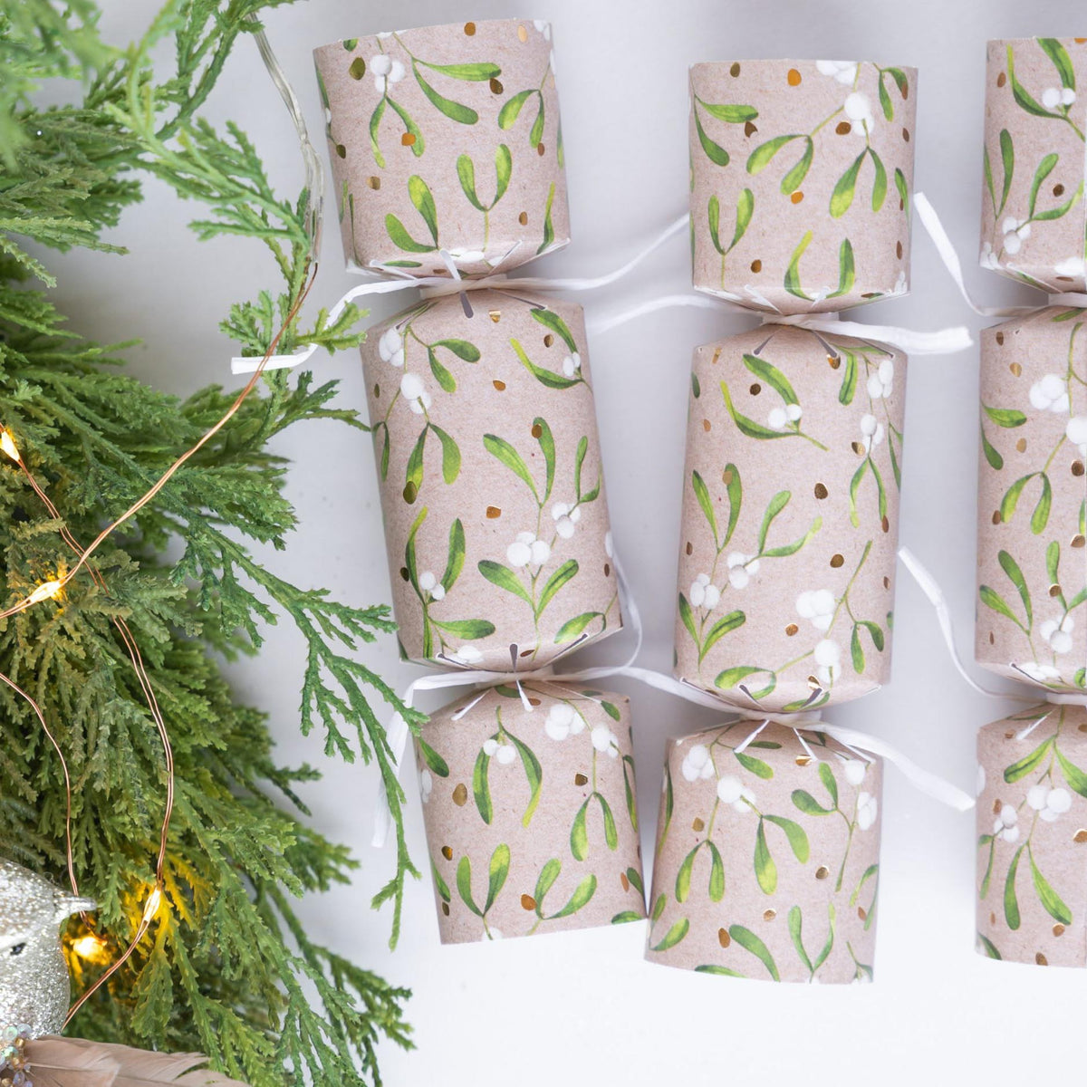 Petite crackers styled next to a lit Christmas tree