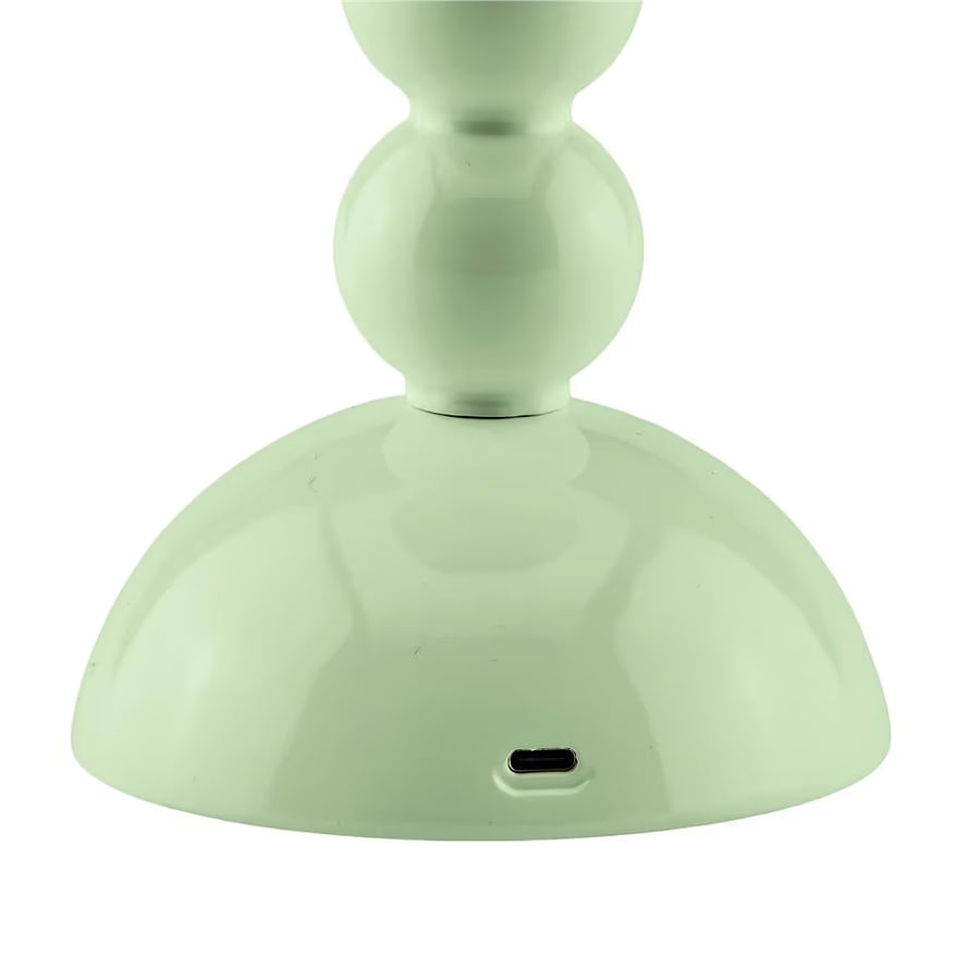 Detail of the USB-C charging port located at the base of the lacquered sage green lamp