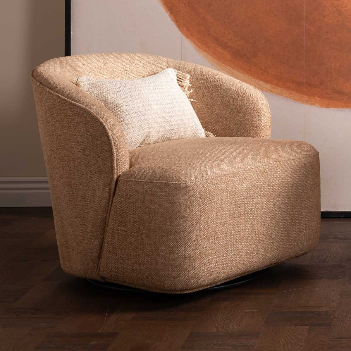 Angled view of the Umbria Armchair highlighting the smooth swivel base and sculpted arms