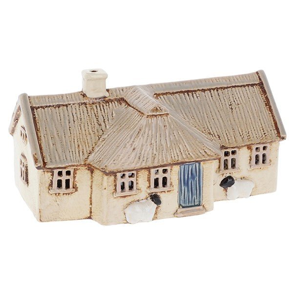 Handmade cream pottery crofter cottage tea-light holder with thatched roof and small sheep figures at the front