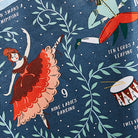 Close-up of the cotton tea towel showing the detailed illustration of Nine Ladies Dancing.