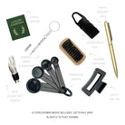 Selection of luxury cracker gifts including a wine pourer, nail brush, pen, and measuring spoons.