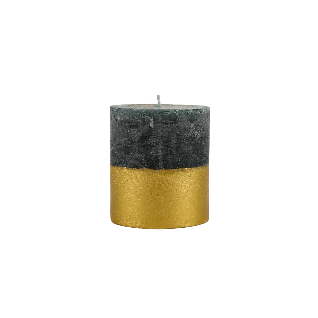 Winter Thyme pillar candle with dark grey-green wax and a shimmering gold-dipped lower half.