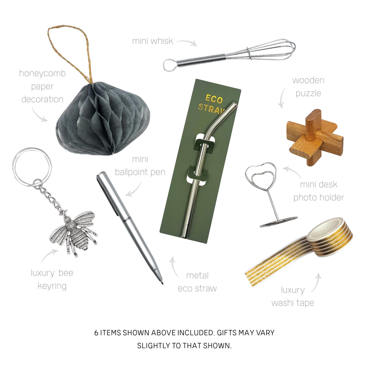 Selection of luxury cracker gifts including a bee keyring, metal straw, wooden puzzle, and mini whisk.