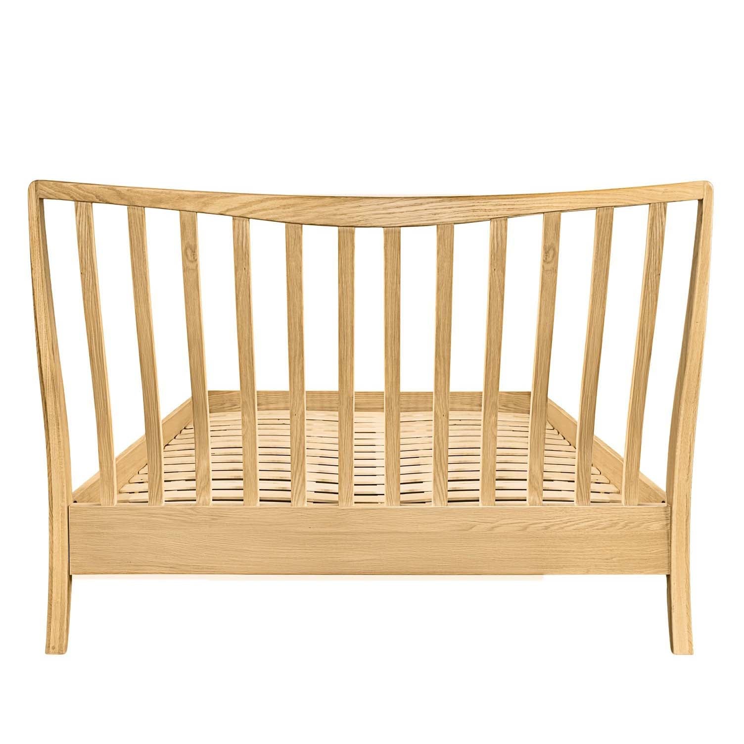 Rear view of the Larsen light oak headboard showing the vertical spindle design