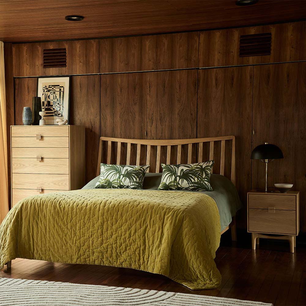 G Plan Larsen bed frame styled in a mid-century bedroom with olive green bedding