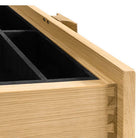 Interior detail of an open drawer showing black felt-lined compartments and high-quality dovetail joinery.