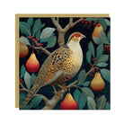 Illustrated Christmas card featuring a partridge perched in a pear tree with red berries against a dark starry sky.