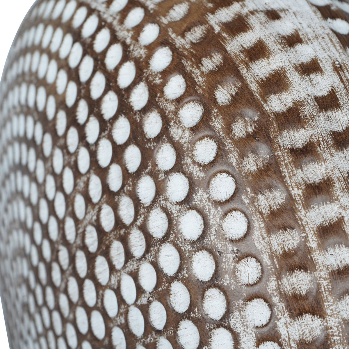 Close-up of the ceramic lamp base showing the dimpled texture and antique brown and cream wood-effect finish