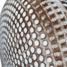 Close-up of the ceramic lamp base showing the dimpled texture and antique brown and cream wood-effect finish