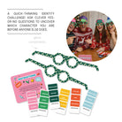 Instruction card and game components with an inset photo of a family playing the game at Christmas.