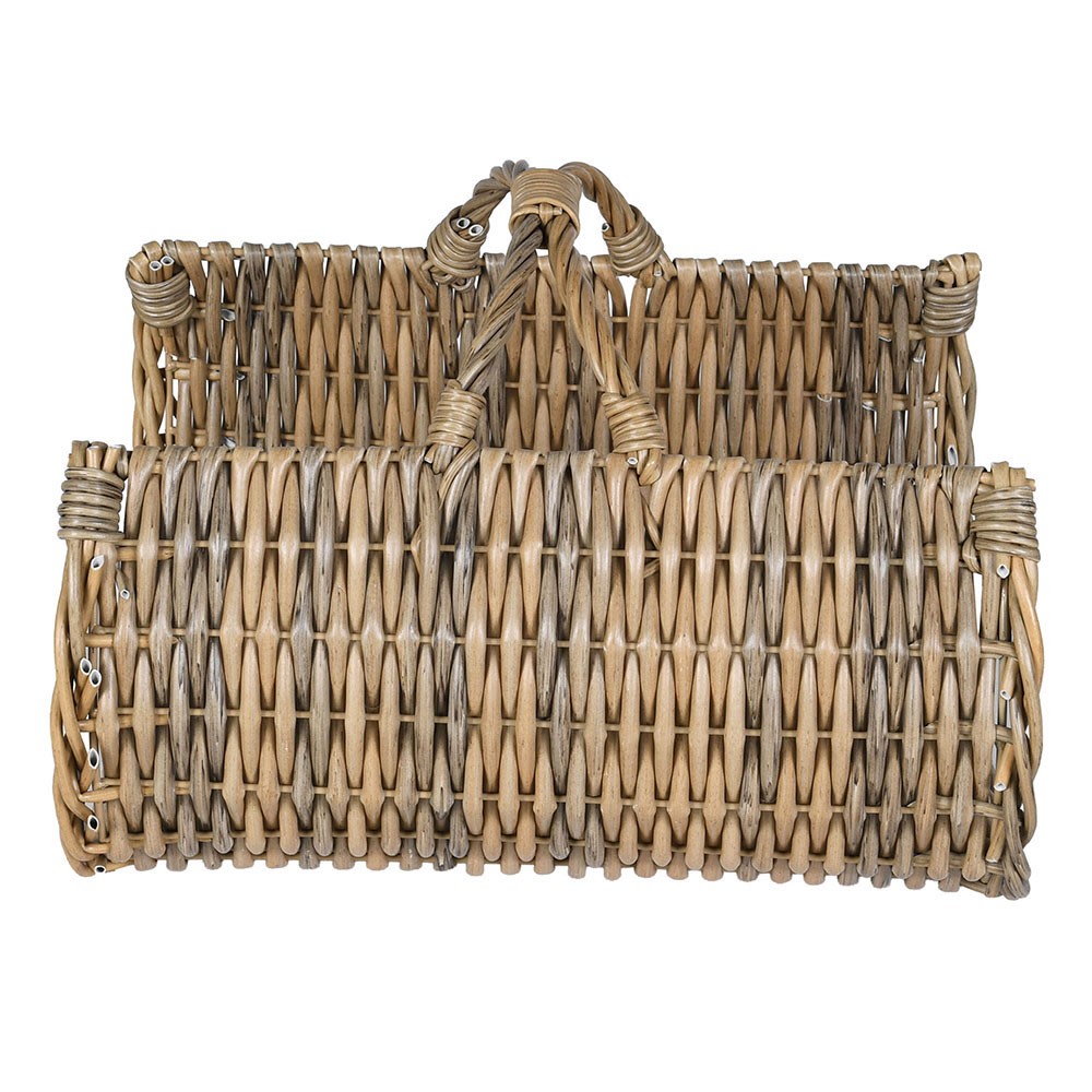 Side profile of the rattan log basket showing its curved shape and woven texture