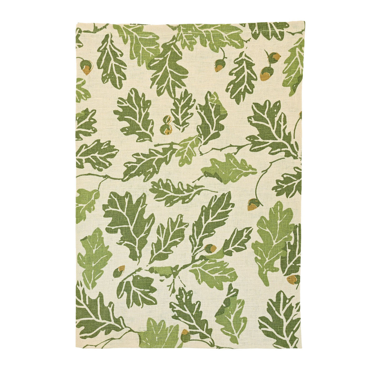 Overhead view of a natural linen fabric swatch with green oak leaf and brown acorn print.