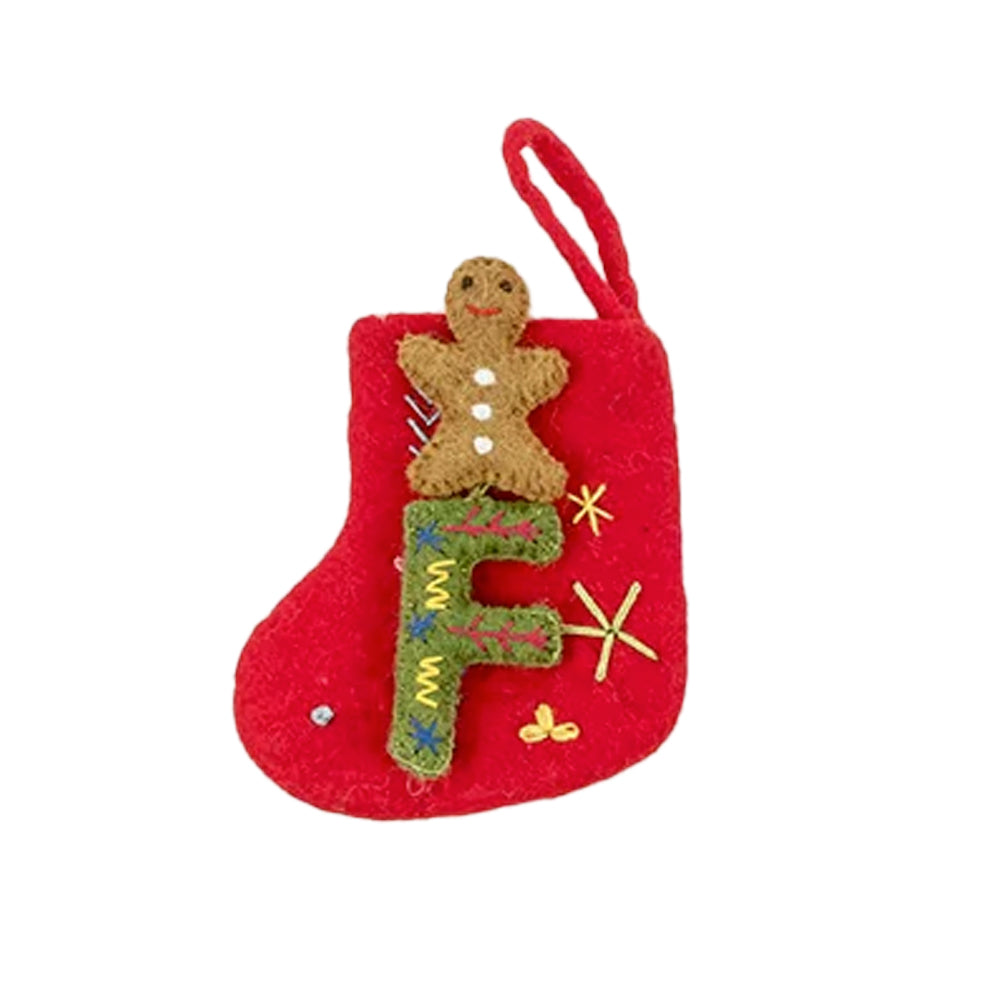 Charming red felt stocking with a green embroidered letter F and gingerbread man topper