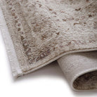 Close-up of the Aurelia Cream rug corner showing the short fringe and woven backing.