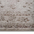 Close-up of the Aurelia Cream rug texture and floral print detailing on the durable polyester yarn.