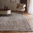 Lifestyle view of the Aurelia Cream rug in a living space with an armchair and side table.