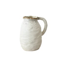 Off-white Beba jug with a tactile ridged surface, grey speckled rim, and a curved handle against a white background.