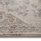 Close-up of the distressed polyester yarn texture and raised geometric pattern details.