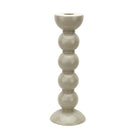 High-gloss cappuccino bobbin candlestick made of rubber wood against a plain white background