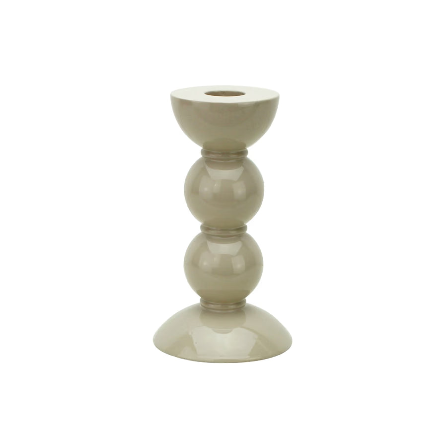 Small bobbin-shaped candlestick in high-gloss cappuccino lacquer against a plain white background