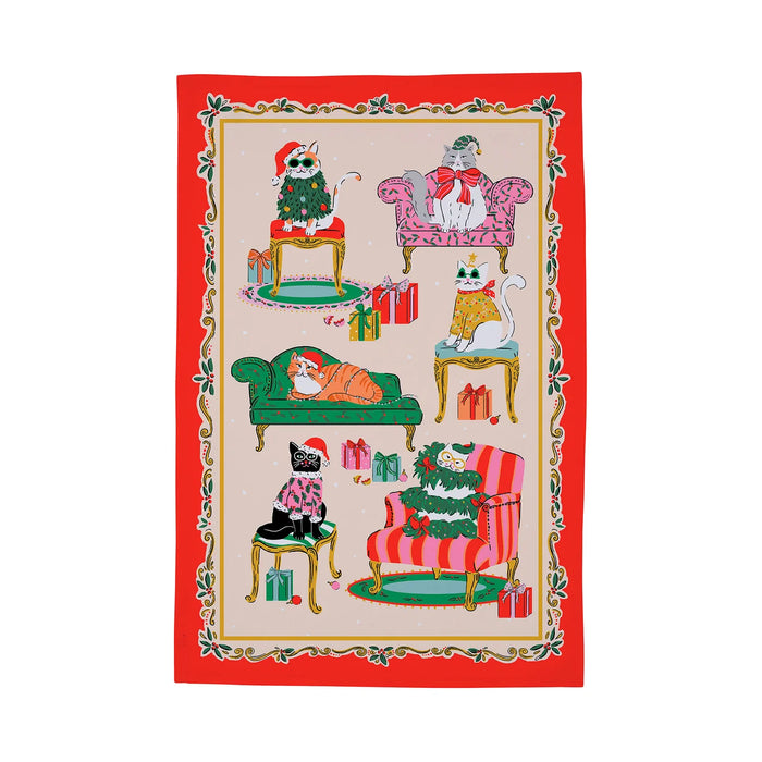 Red-bordered Christmas tea towel with illustrations of cats in festive outfits on furniture