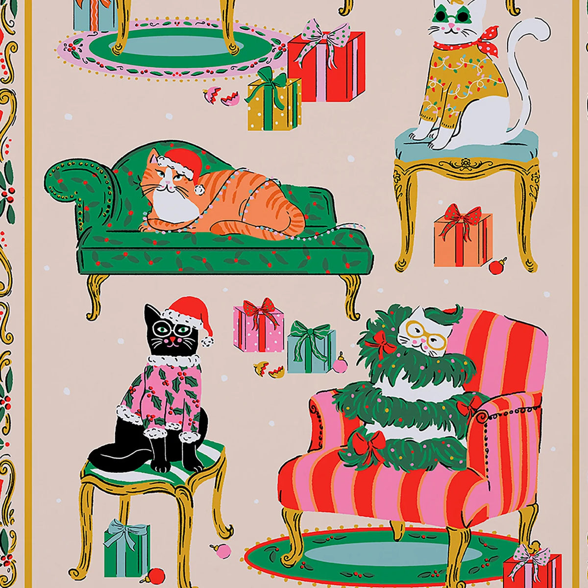 Close-up of cat illustrations on a tea towel including a black cat in a holly jumper and an orange tabby