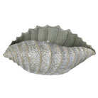 Front view of the large ceramic shell decoration highlighting its wide, fluid coastal form.