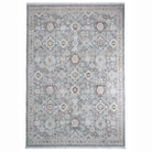 Overhead view of Celeste Sea Green rug showing intricate floral pattern and short white fringe.