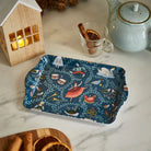 Small 12 Days of Christmas tray styled on a kitchen counter with a teapot and festive decorations
