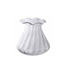 Clear glass vase with a flared, wavy rim and a wide textured base against a plain white background.
