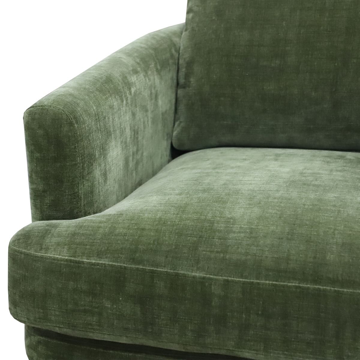 Close-up of the green velvet upholstery and armrest detail on the Florence chair
